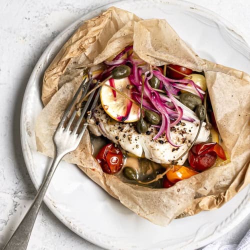 Fish en papillote served on plate