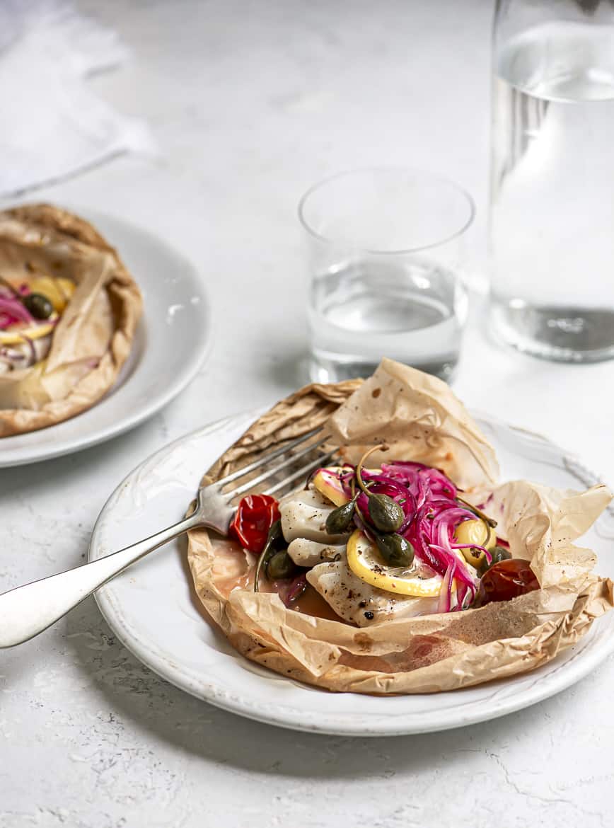 Fish en papillote served on plate