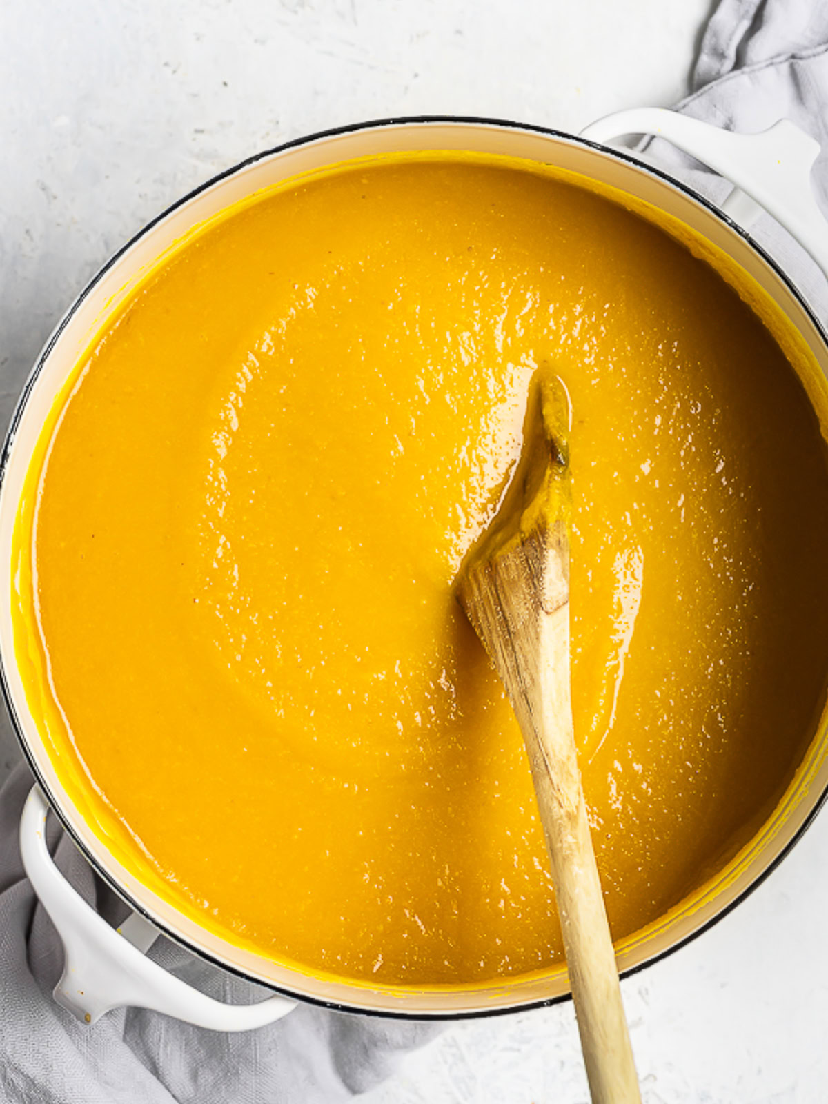 Blended Roasted Carrot soup in white soup pot