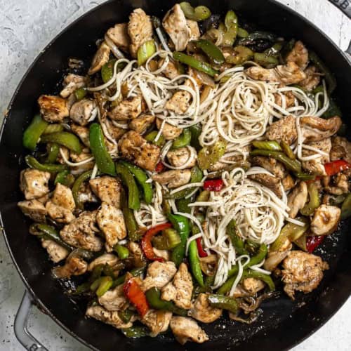 Black Pepper Chicken in skillet with noodles