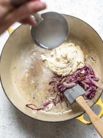 Preparing hummus sauce in pan