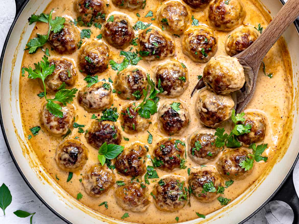 Chicken Meatballs in Thai curry sauce in pan