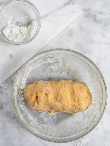 Forming dough log to make sweet potato gnocchi