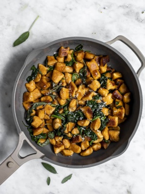 Sweet Potato Gnocchi in skillet with browned butter and sage