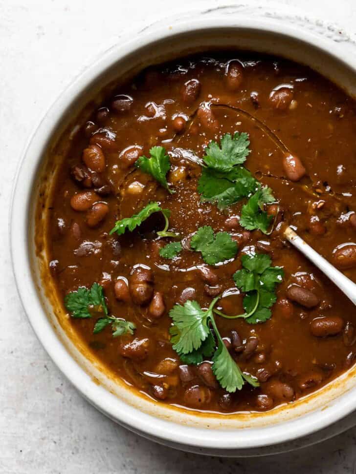 Dominican Habichuelas Guisadas in bowl with spoon