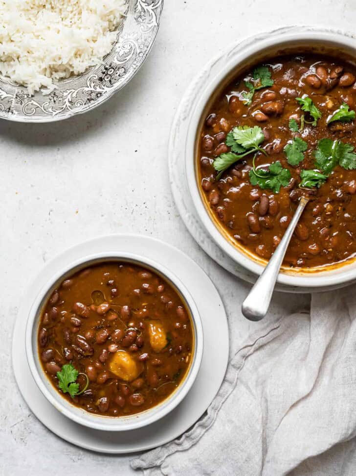 Dominican Habichuelas Guisadas in bowls with rice on the side