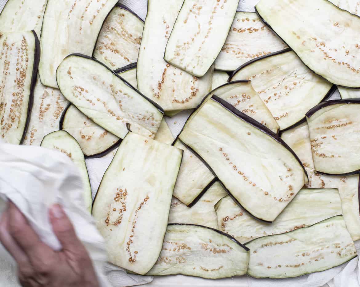 drying the eggplant with paper towel