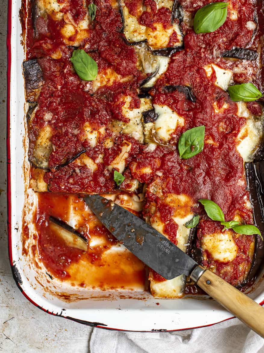 Baked eggplant parmesan with piece cut out