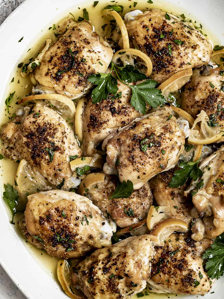 baked lemon chicken thighs on platter