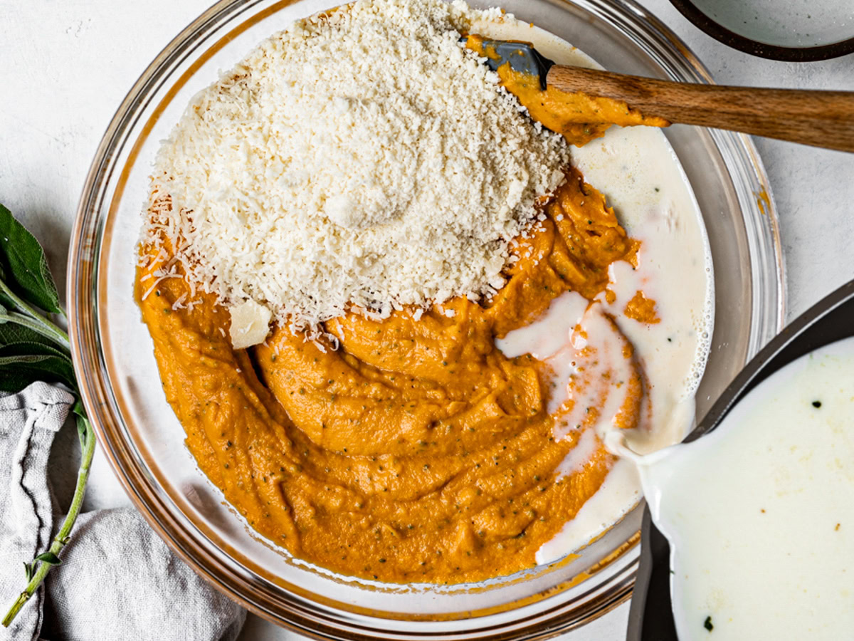 Adding milk and cheese to sweet potato mixture