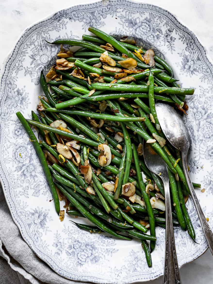 Haricots Verts Mandine on platter with serving spoons