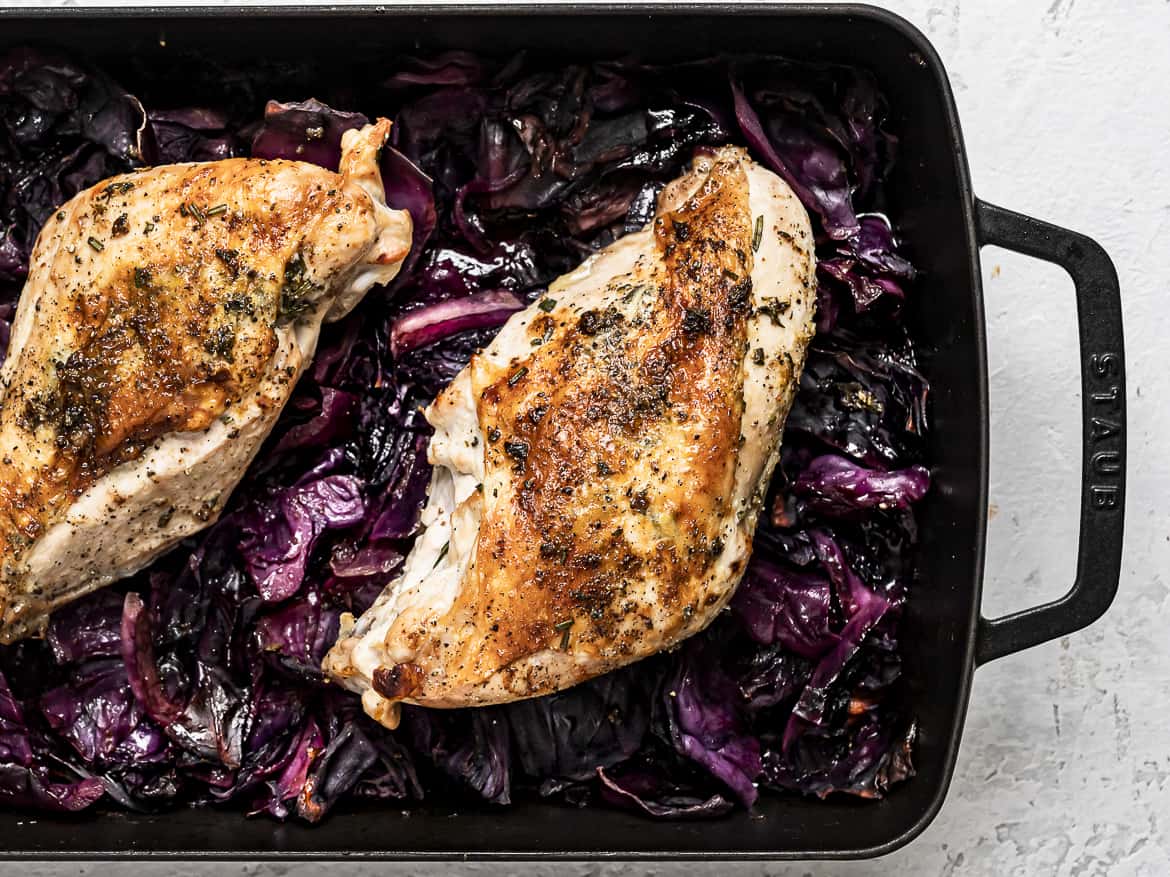 close up of Roast Turkey Breast on top of Braised Red Cabbage in roasting pan