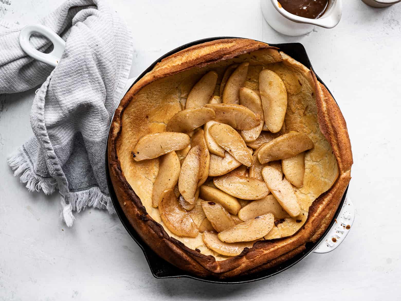 Dutch baby topped with caramelized apples