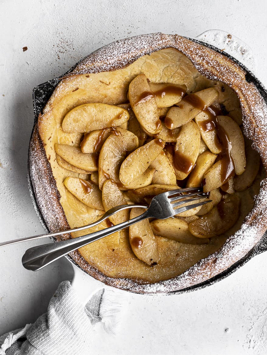 Dutch Baby with Caramelized apples in skillet