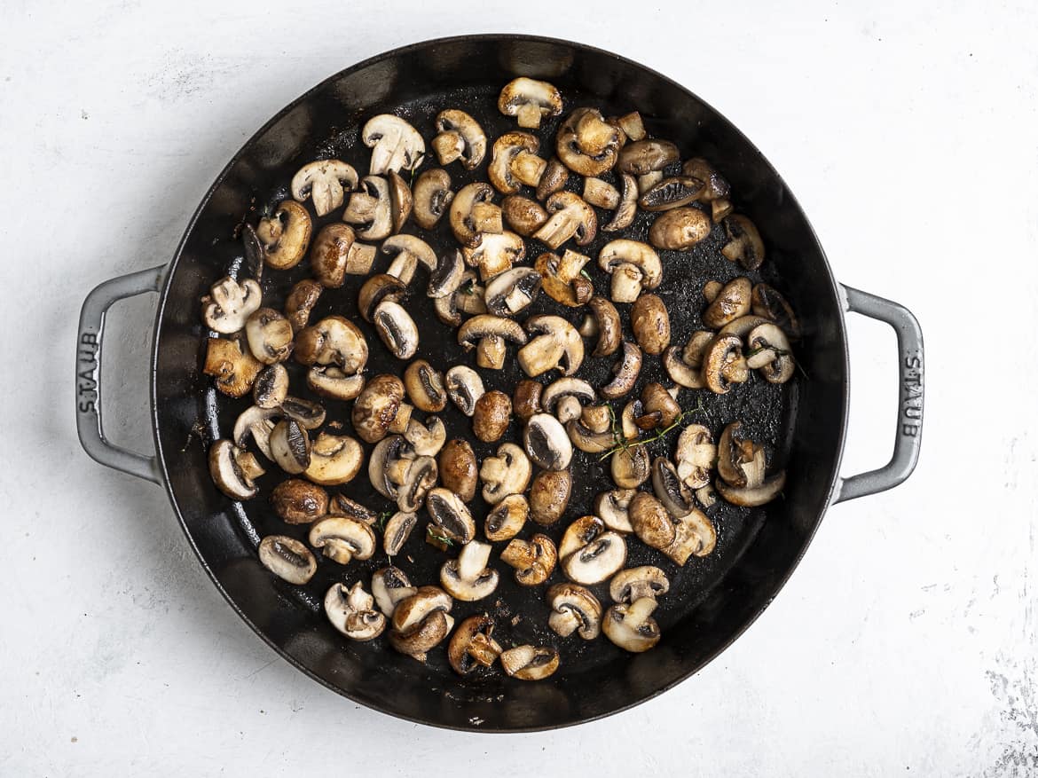 mushrooms browning in skillet