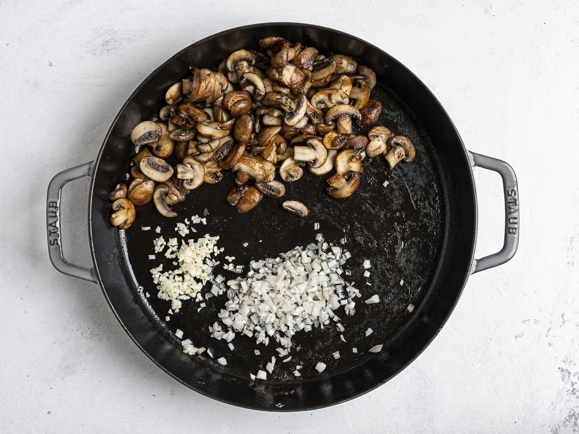 Sautéing shallots and garlic with mushrooms