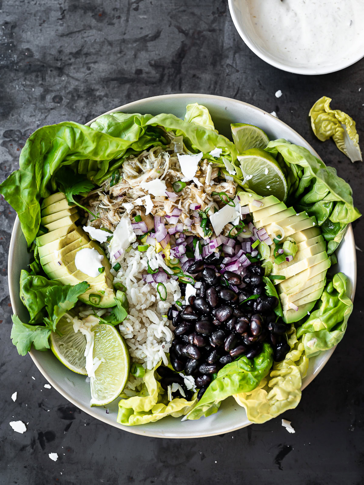 Salsa Verde Chicken in a burrito bowl with rice and black beans