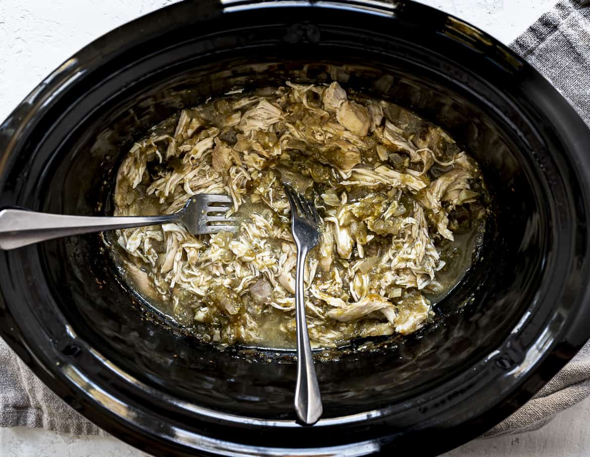 Shredding Salsa Verde Chicken in Slow Cooker