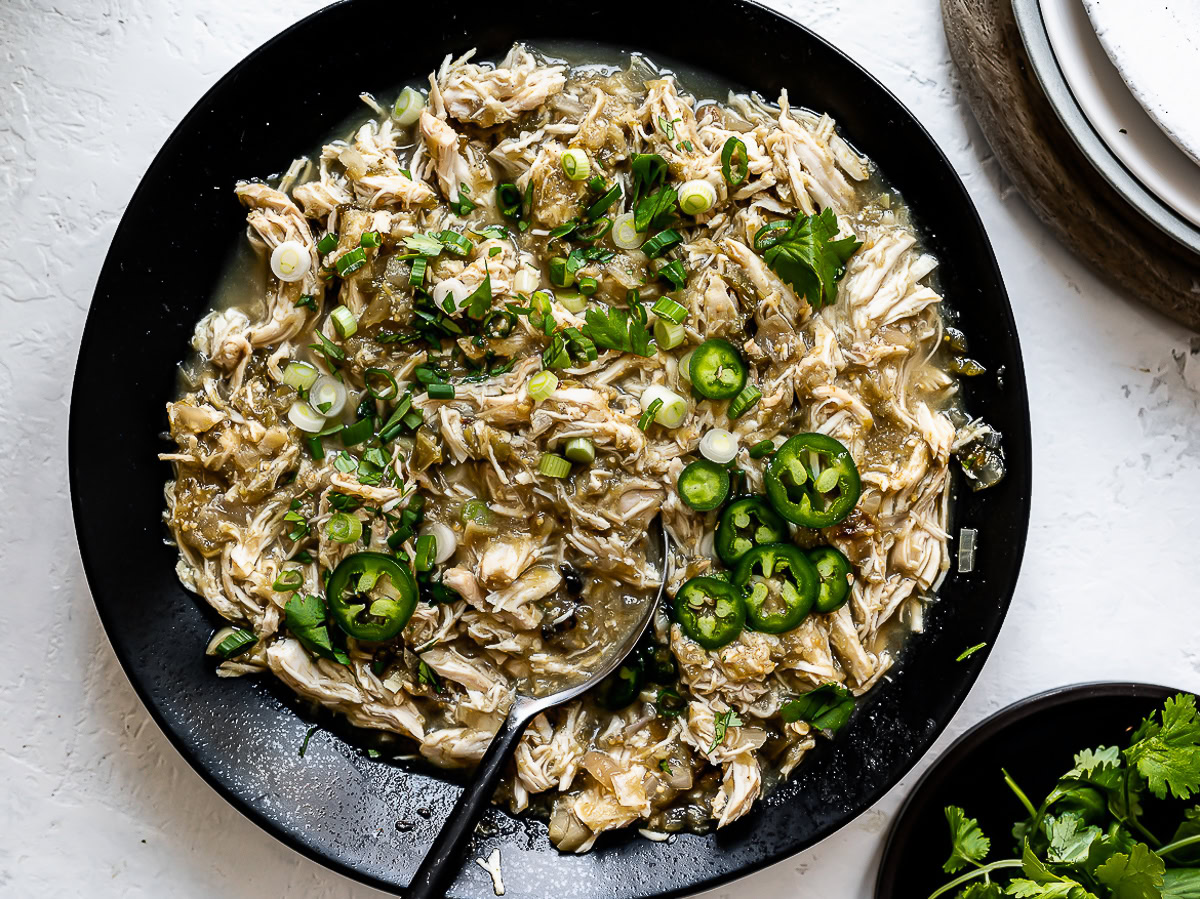 Slow Cooker Salsa Verde Chicken served in black bowl