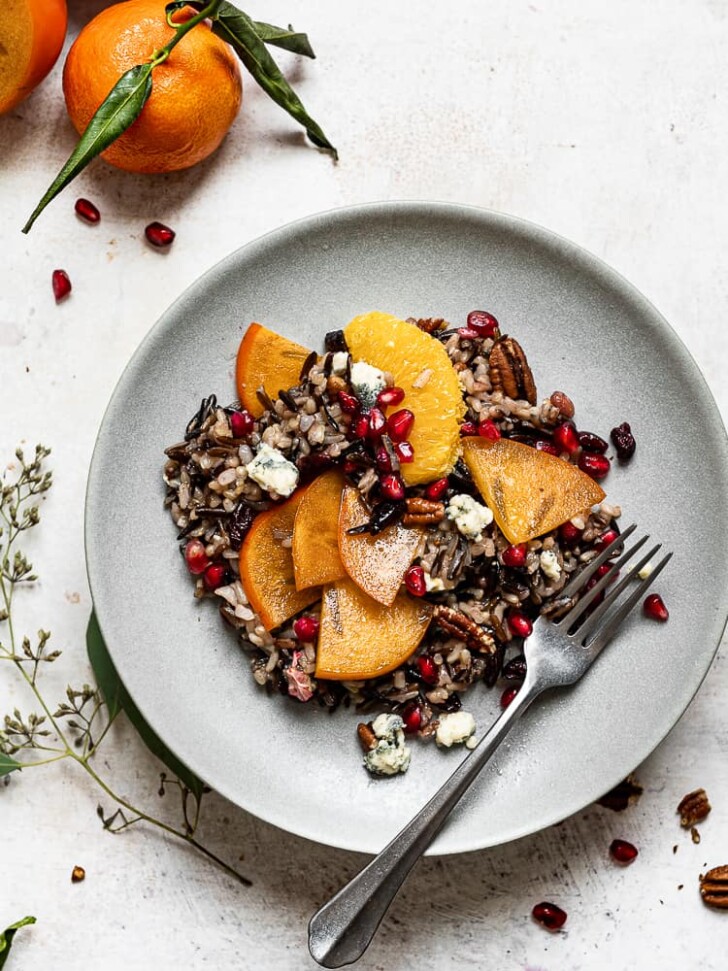 Wild rice salad with persimmons in served on plate