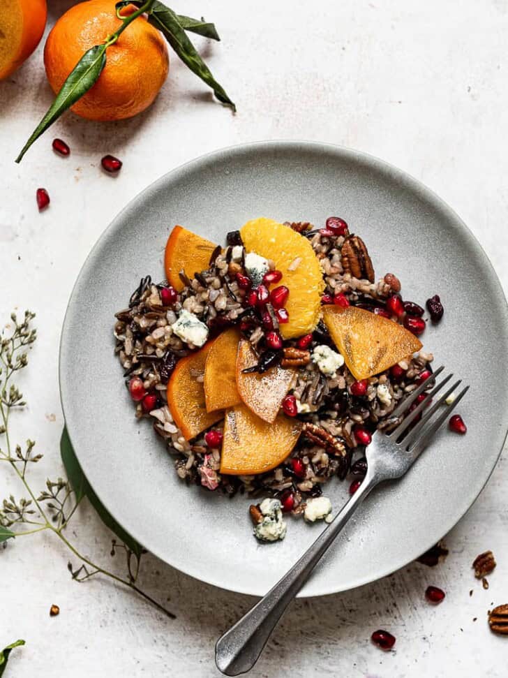 Wild rice salad with persimmons in served on plate