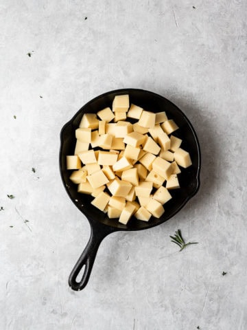 Cubed Fontina in skillet