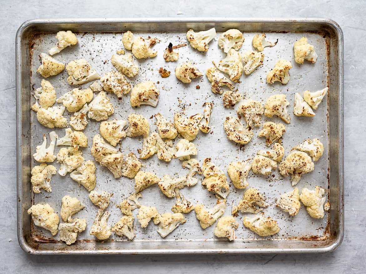 Broiled cauliflower on baking sheet