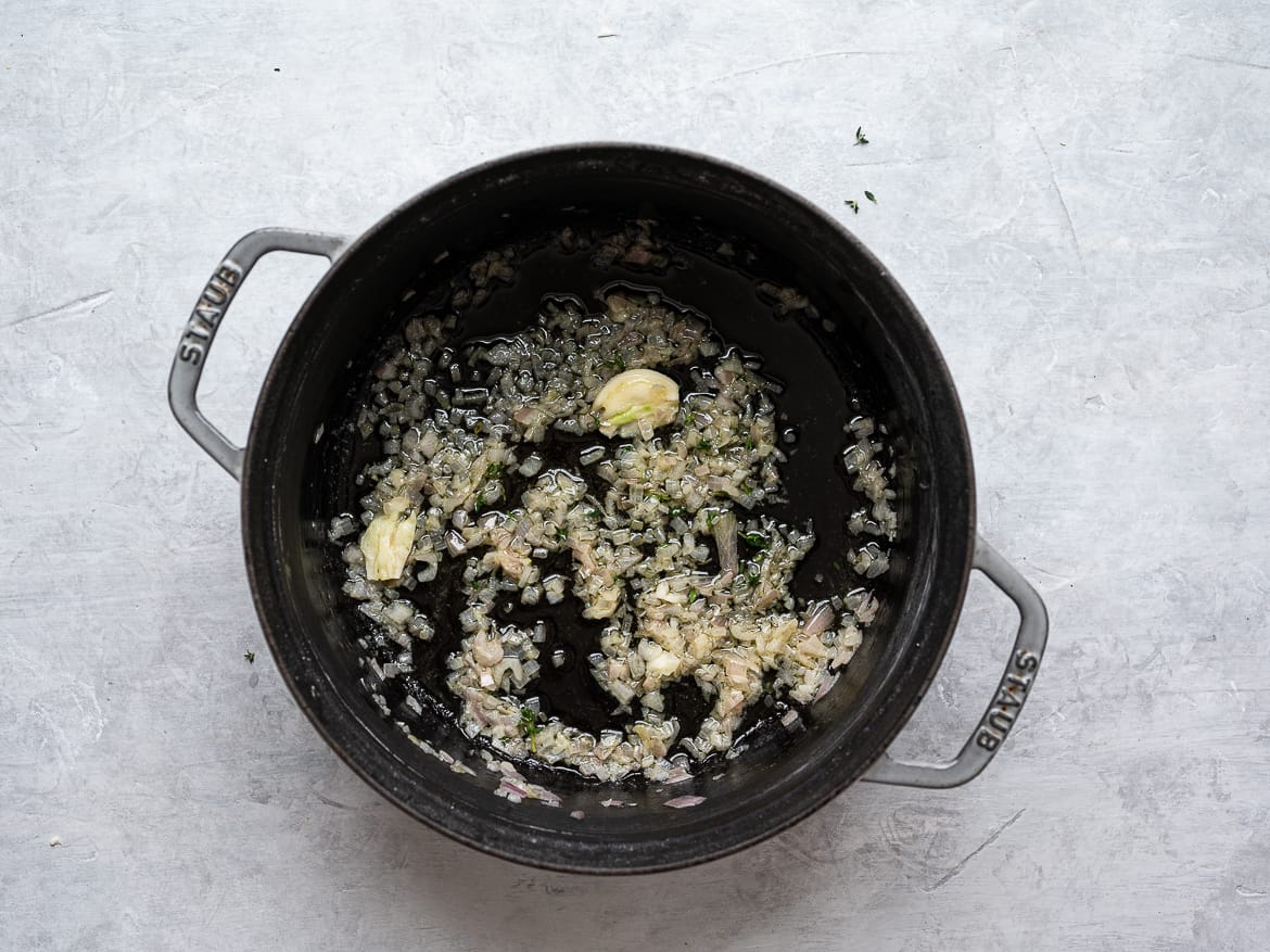 Shallots and garlic cooked in butter in large pot