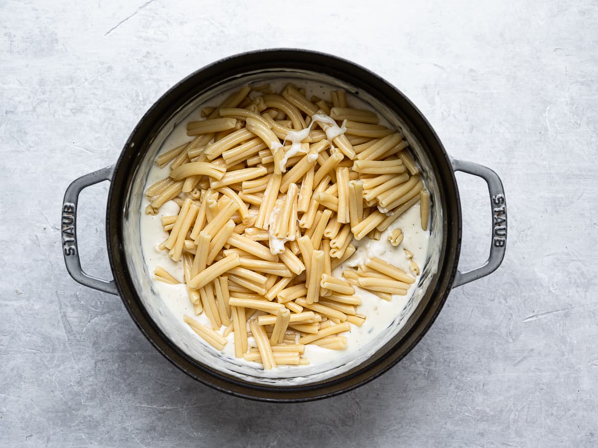 Adding cooked pasta to cheese sauce