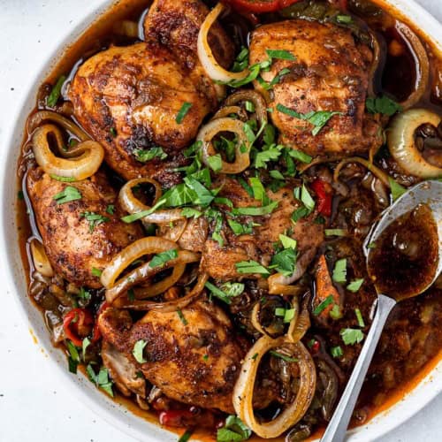 Instant Pot Chicken thighs on platter with spoon