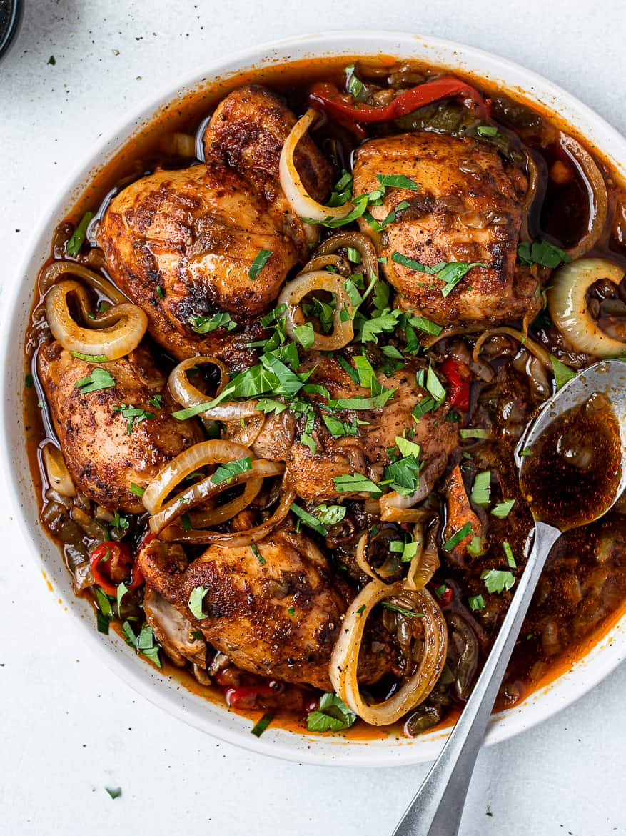 Instant Pot Chicken thighs on platter with spoon
