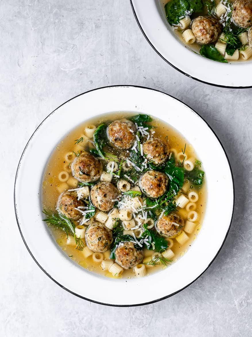 Italian Wedding soup served in bowls.