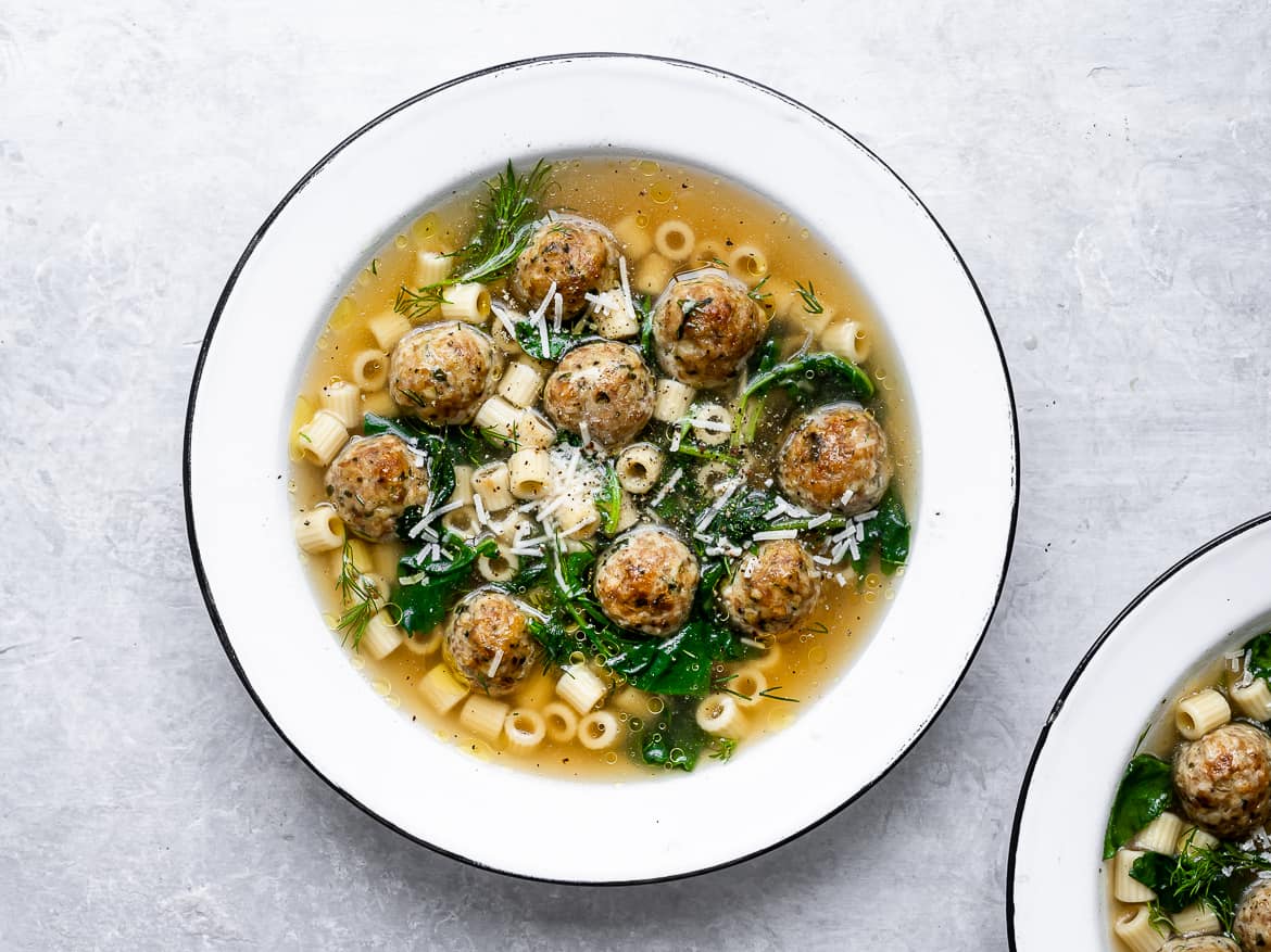 Italian Wedding soup served in bowls.