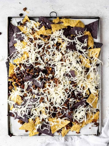 layering nachos with cheese