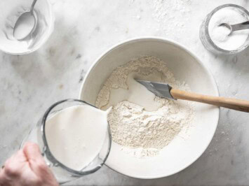 Pouring yogurt mixture into flour mixture