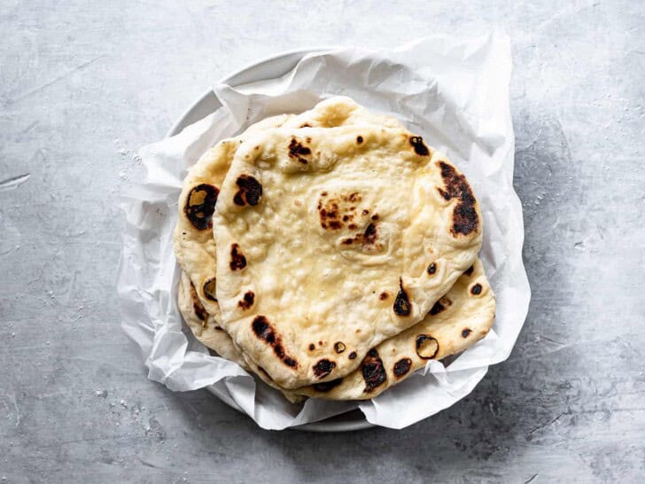 naan stacked on a plate