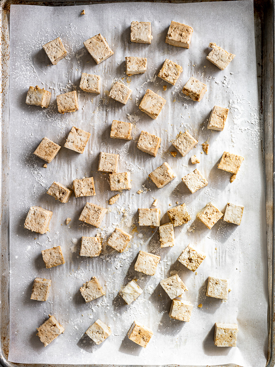 Tofu cubes on sheet pan ready to get roasted. 