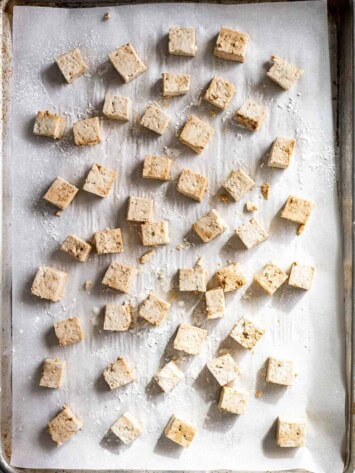 cubed tofu on baking sheet