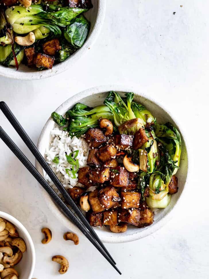 Tofu and Bok Choy stir fry in bowls with cashews