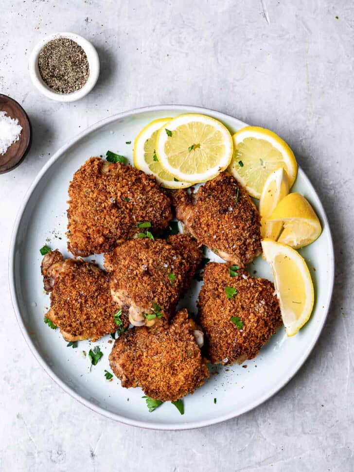 crispy baked chicken thighs on plate 