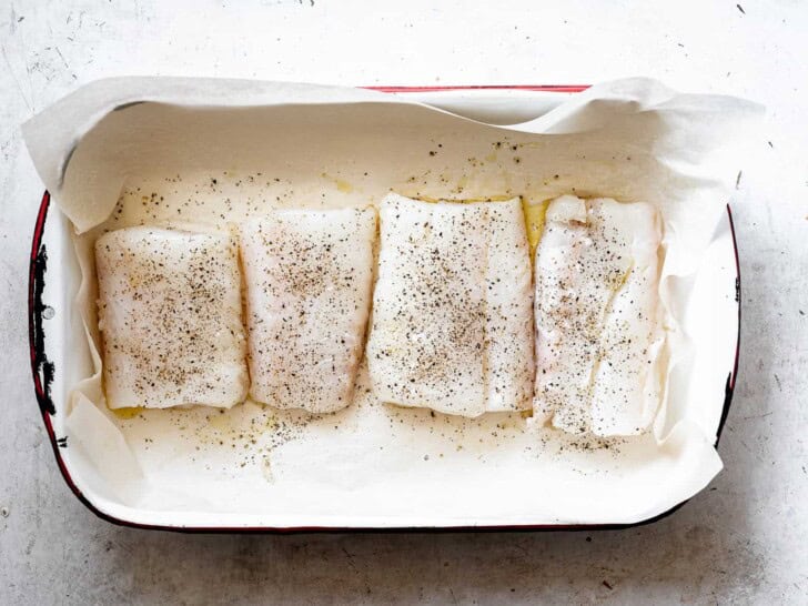 unbaked cod fillets in roasting pan