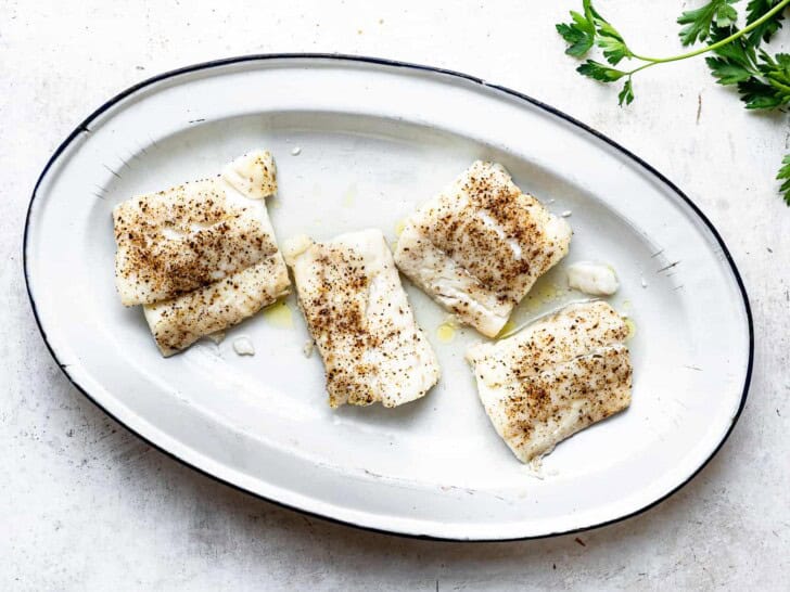 baked cod fillets on platter