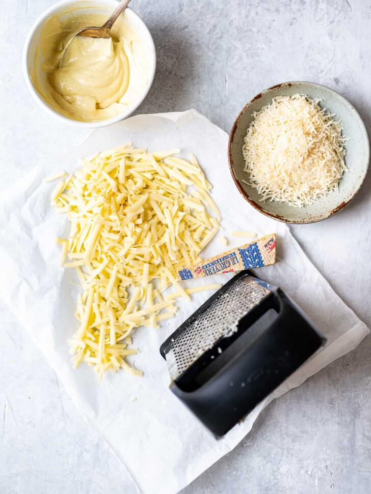 Grated gruyere and parmesan