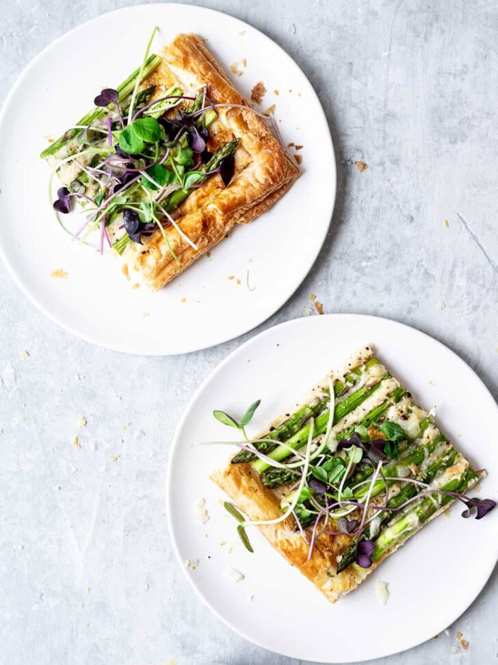 tart served on plates topped with micro greens 