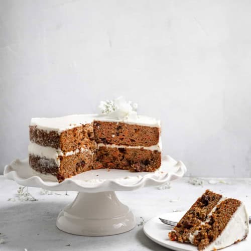 Sliced grain free carrot cake on stand