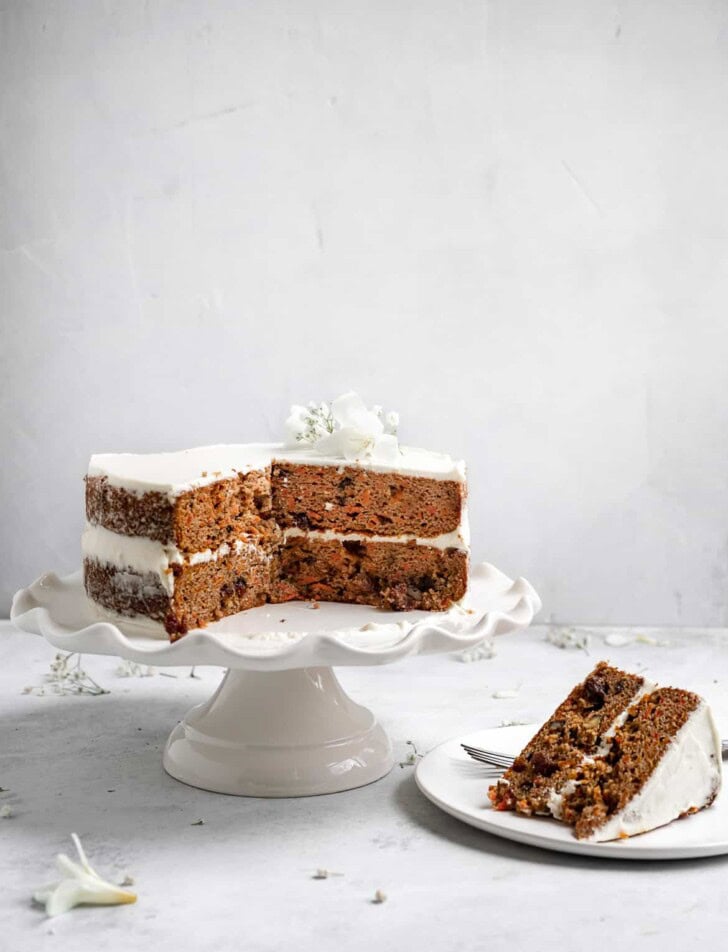 Sliced grain free carrot cake on stand 