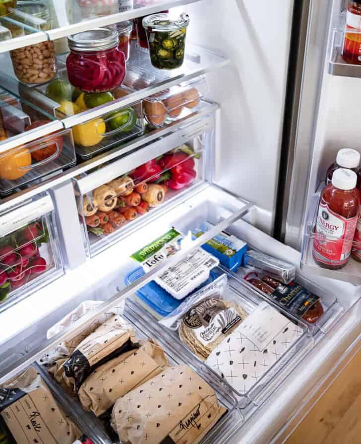 close up of cheese and deli drawer in fridge