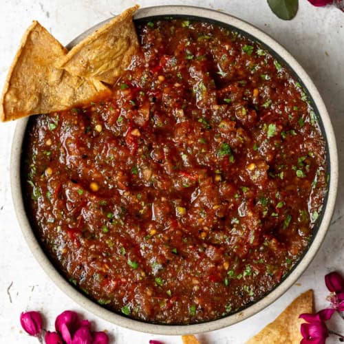 Charred Tomato Salsa in bowl with tortilla chips