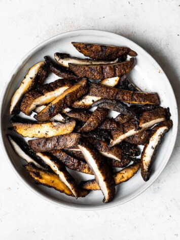 Grilled and sliced Portobello mushrooms on plate
