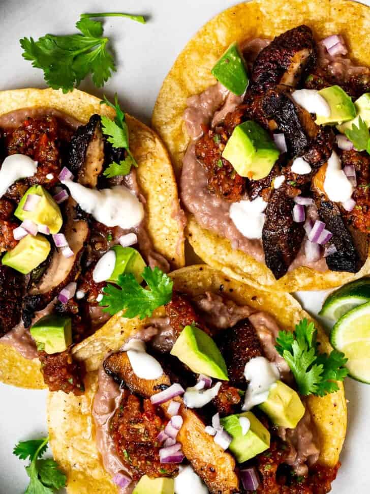 close up of Mushroom Tostadas with refried beans